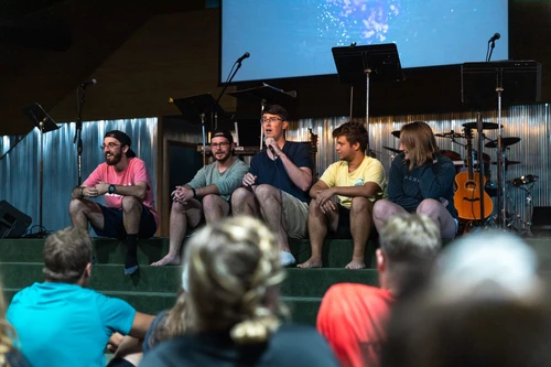 Campus Pastor speaking with students.